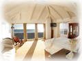 Master Bedroom with Full View of Pacific Ocean and King Sized Bed.